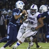 Lemoore's Noah Wright keys on Ranger quarterback Frankie Ayon in 31-14 loss Friday night.